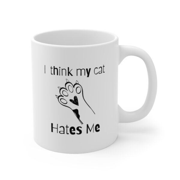 Embrace your feline friend's enigmatic charm with our "I think my cat hates me" 11 oz Coffee Mug! - Image 2