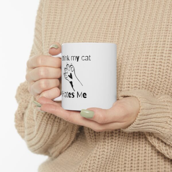 Embrace your feline friend's enigmatic charm with our "I think my cat hates me" 11 oz Coffee Mug! - Image 6